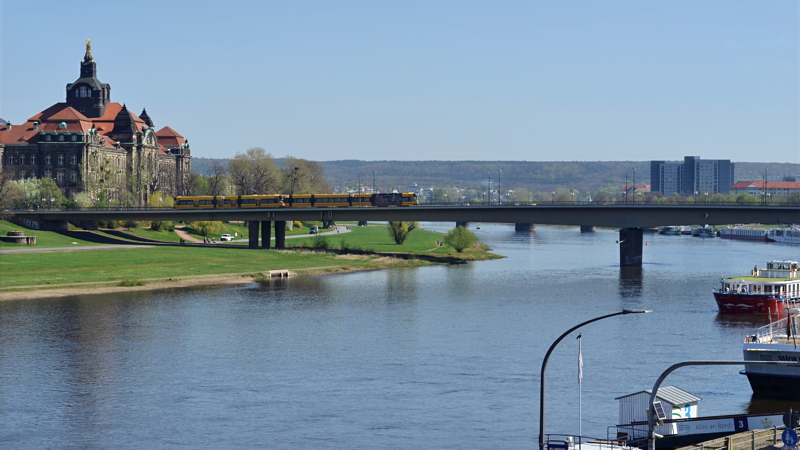 16 - The historic Carola Bridge (Carolabrücke) spanning the Elbe River in Dresden, Germany, with the prominent Saxon State Chancellery building visible on the left bank